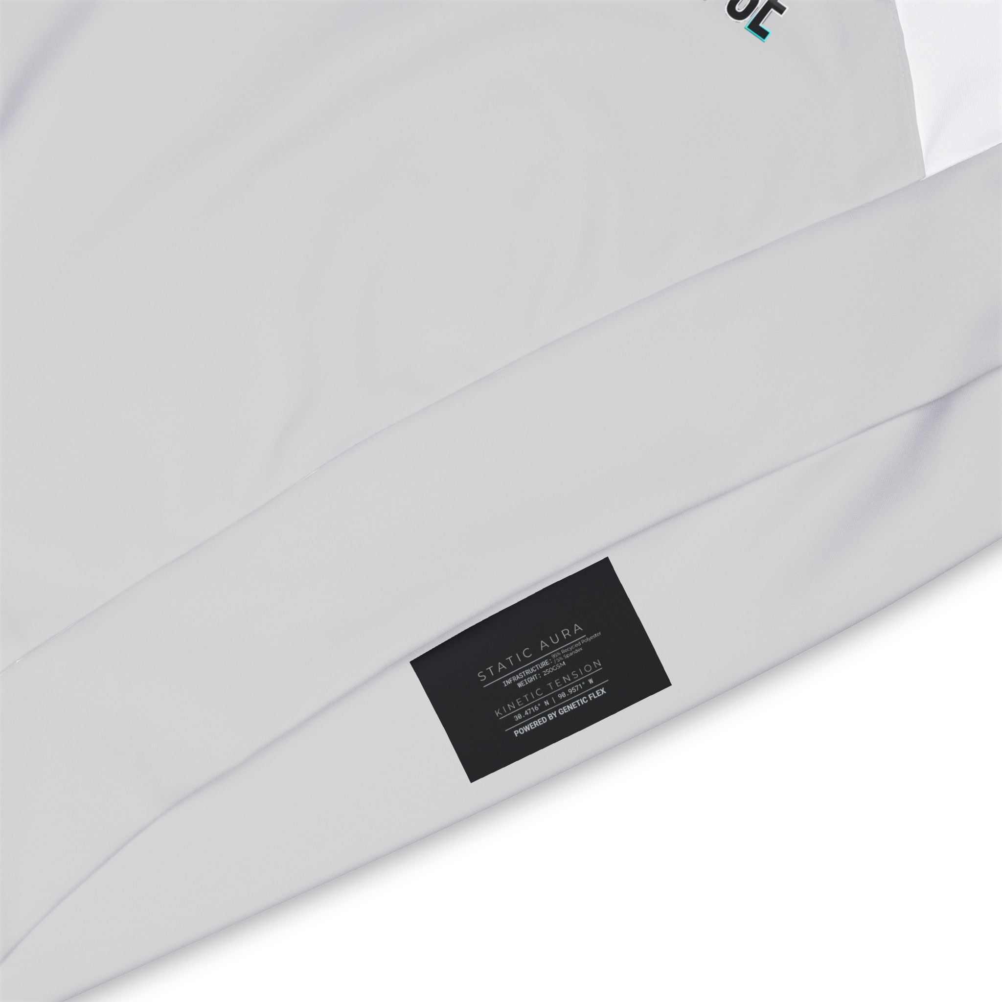 Close-up of hoodie tag label on a light gray background